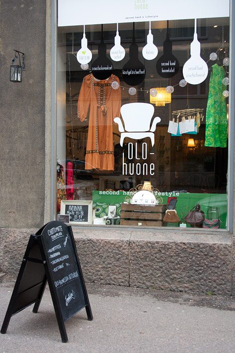 Exterior of OLO-huone, a second-hand and lifestyle shop in Helsinki, showcasing sustainable and budget-friendly shopping options.